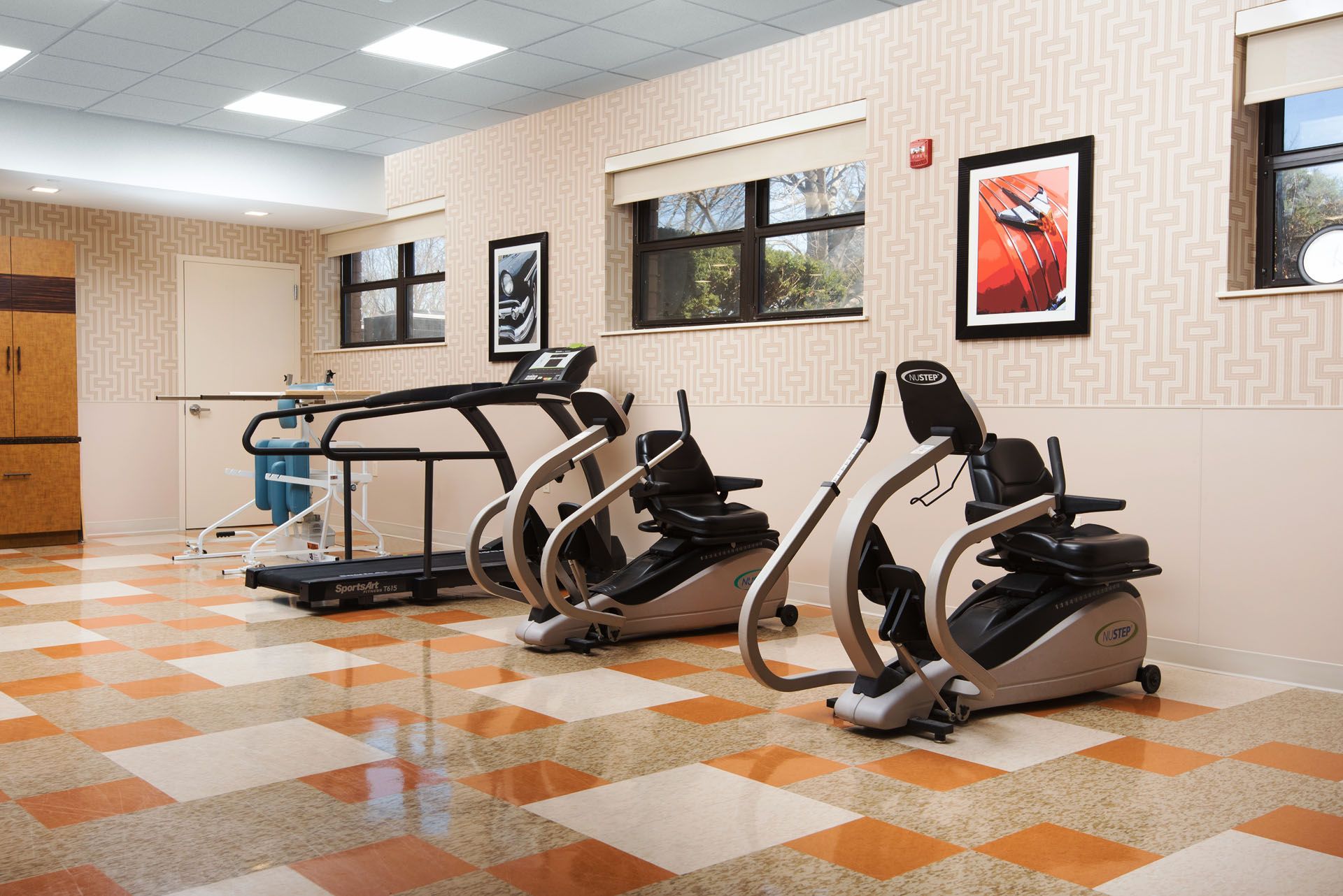 Interior view of a therapy gym with exercise equipment