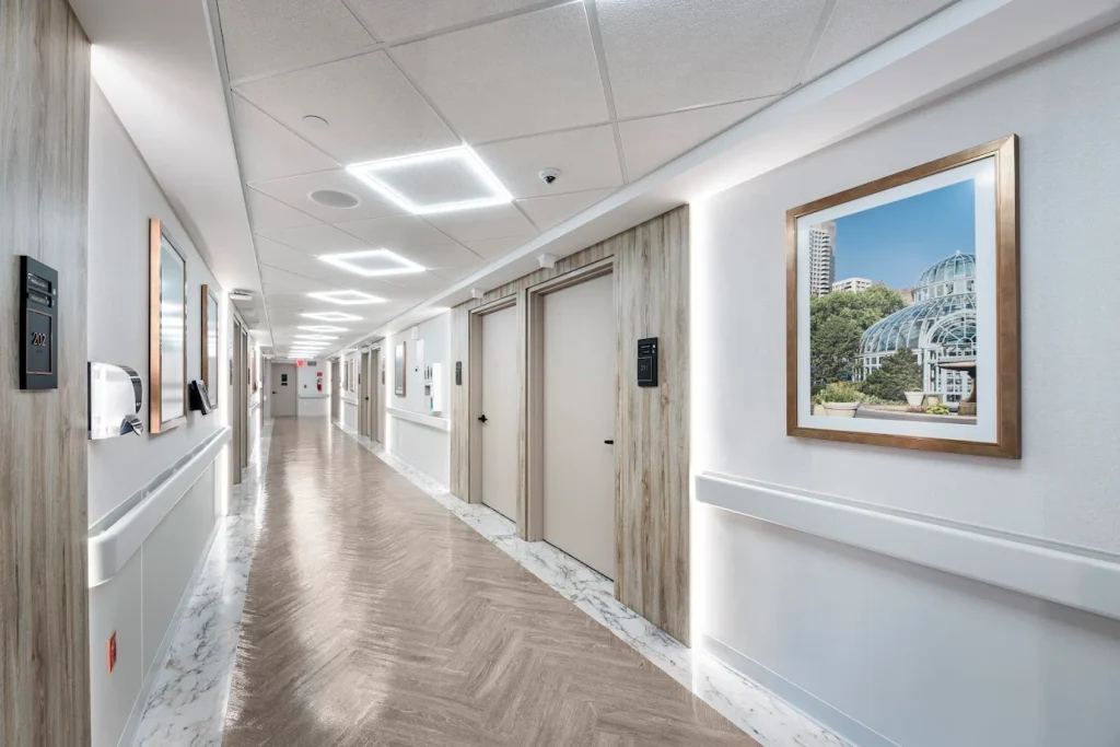 A brightly lit corridor in a senior living facility