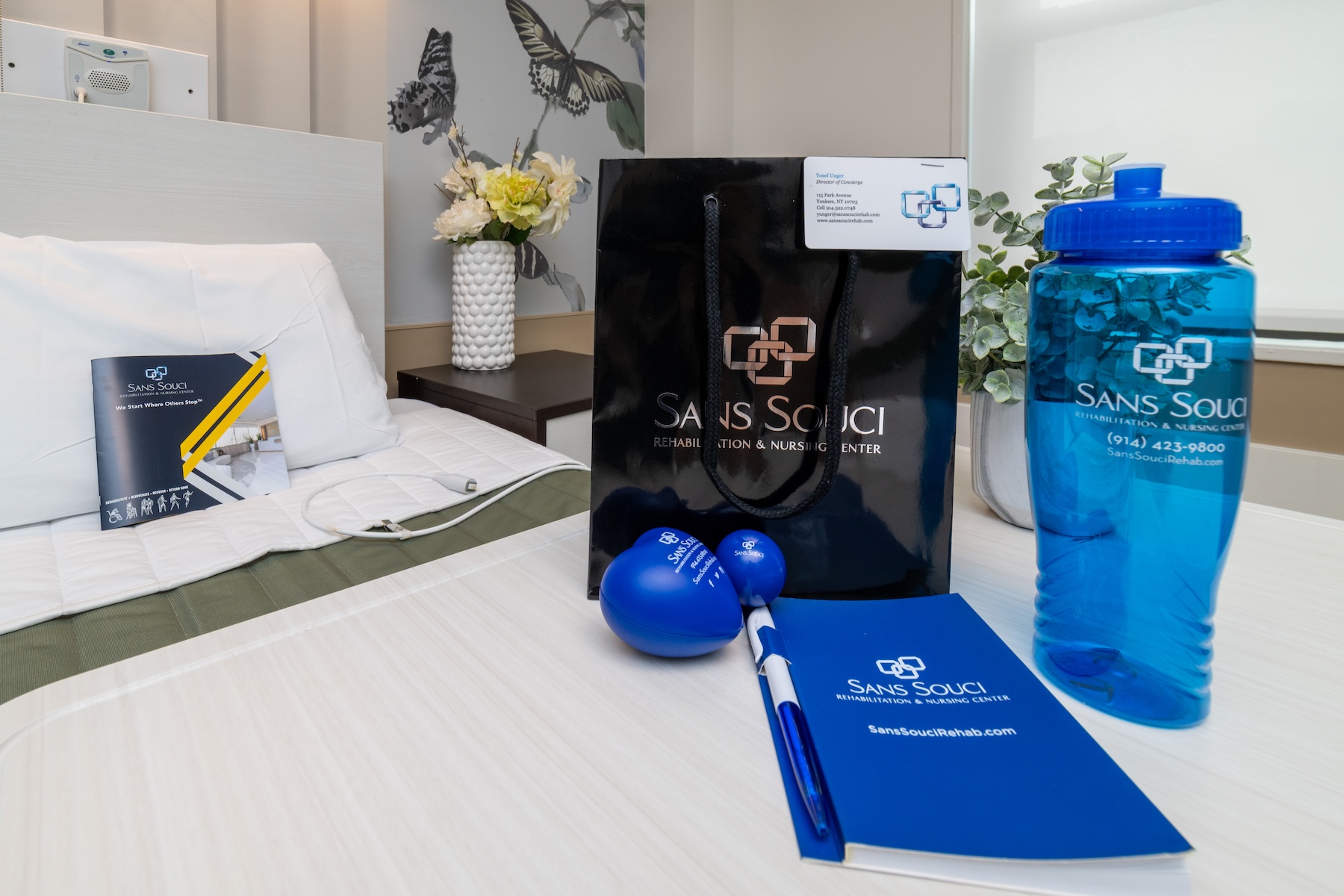 Branded items on a bedside table in a room