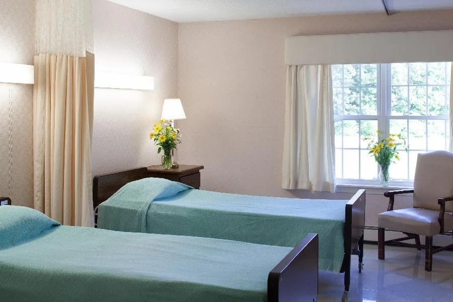 Shared resident room with beds and natural light