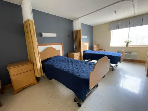 Interior view of a shared resident room with beds
