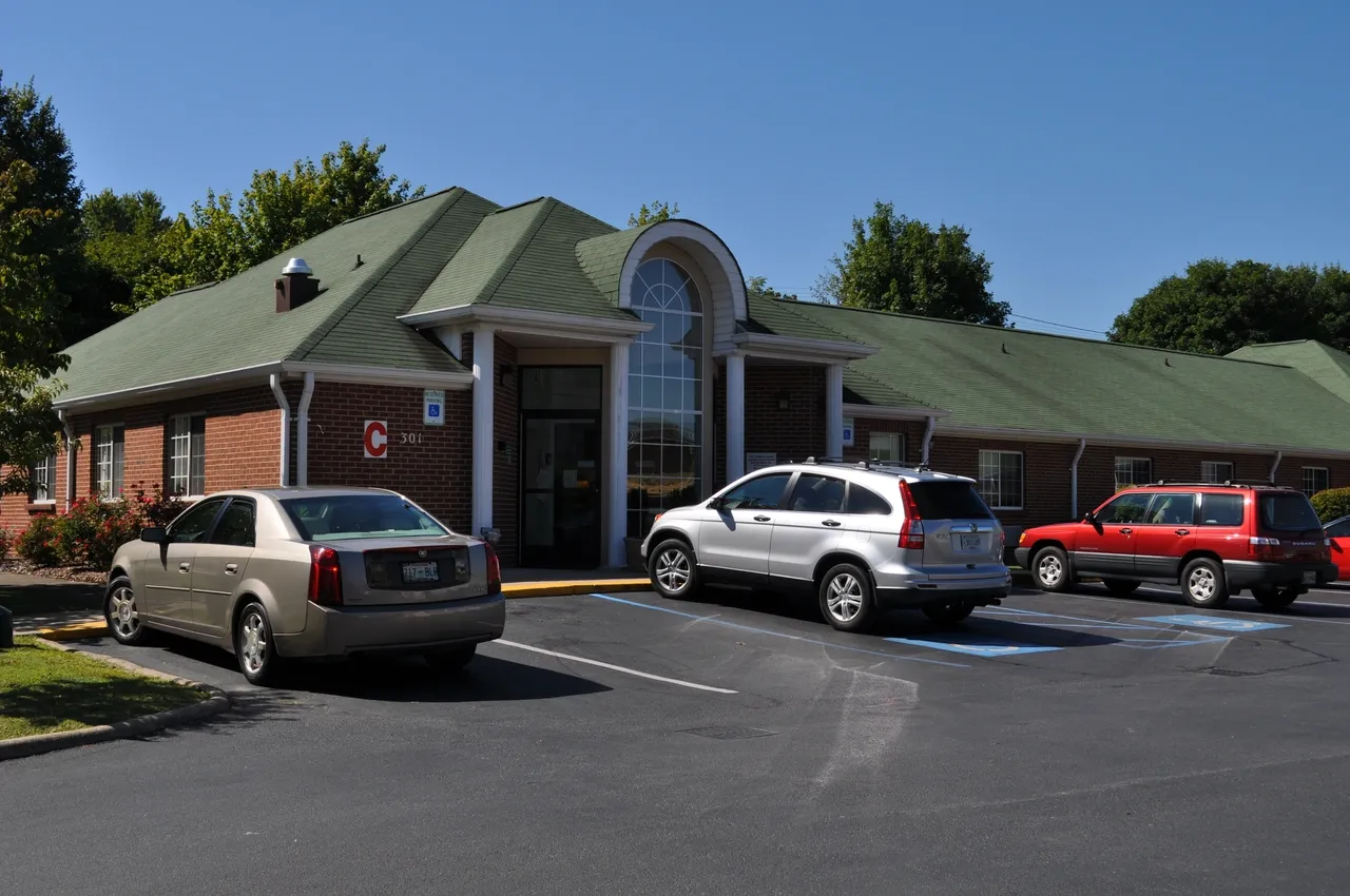 Exterior view of Ivy Hall Nursing Home with accessible parking