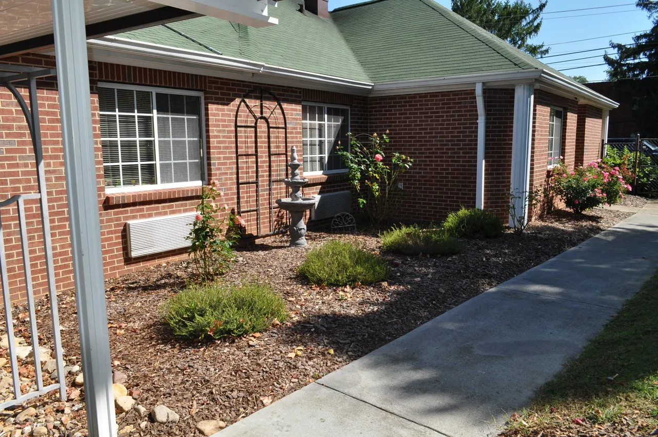 Outdoor garden area with landscaping and a fountain