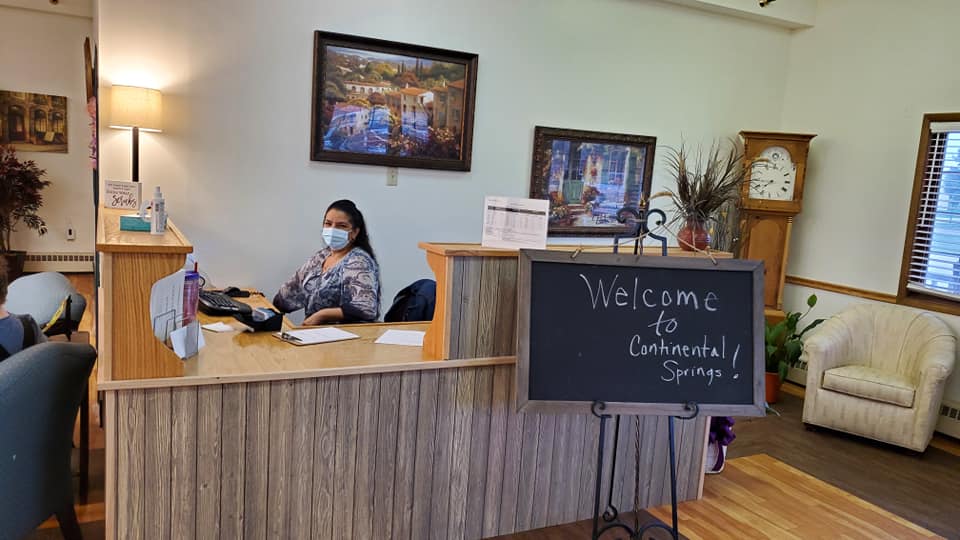 Reception area with staff member at desk