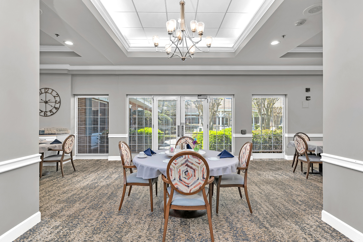 Dining area with tables set for residents