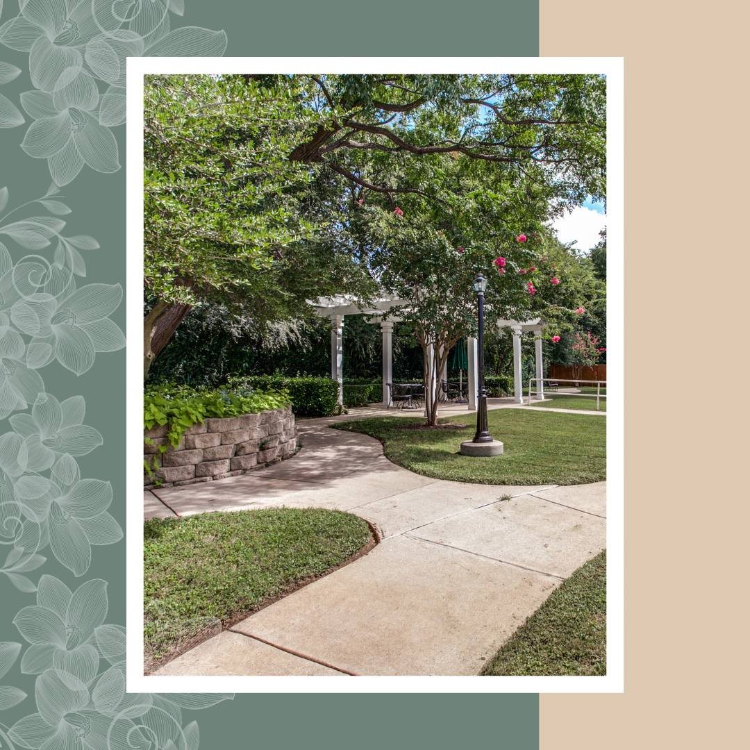 A garden path with greenery and seating areas