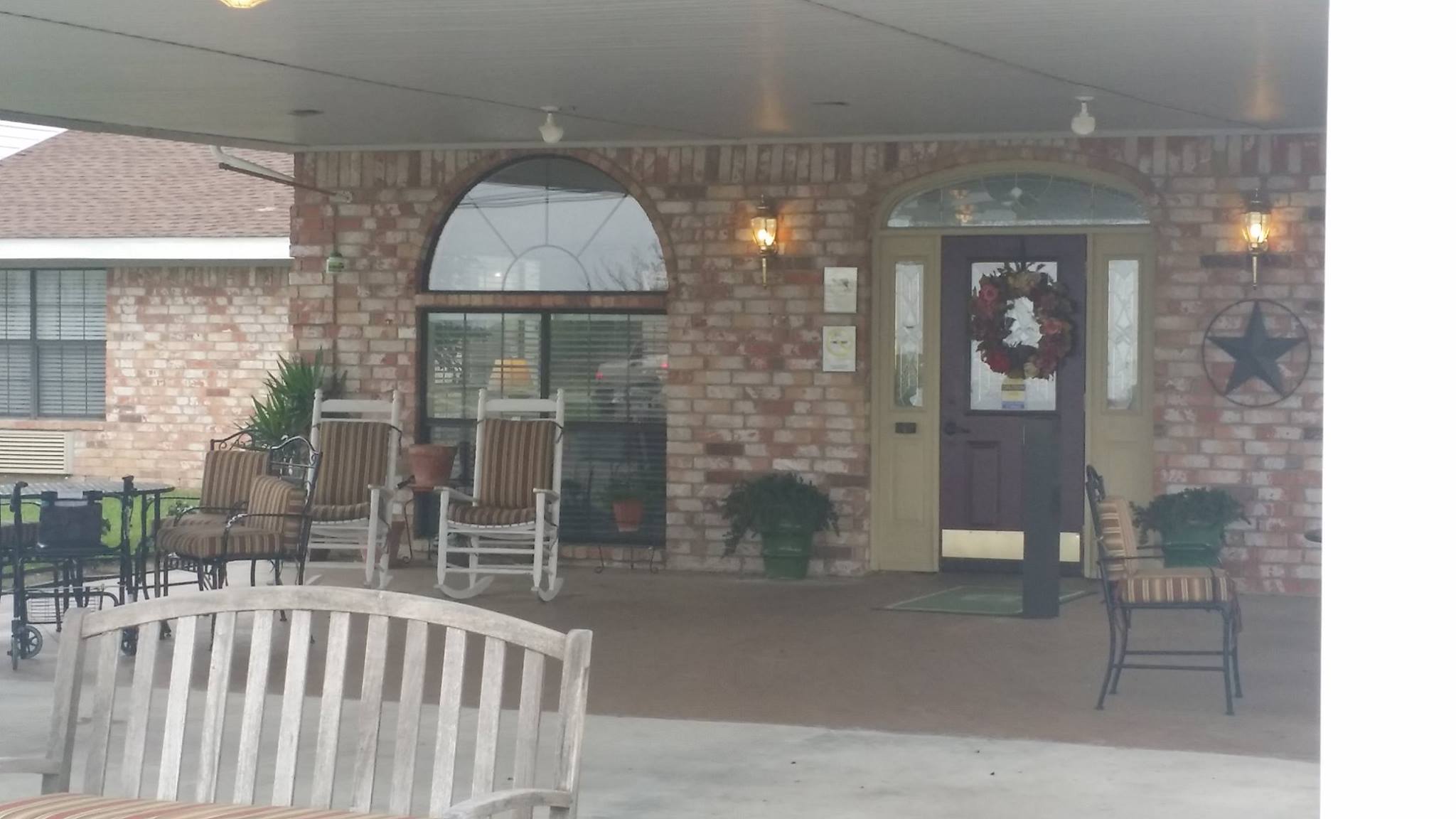 Entrance area of a senior living facility with rocking chairs