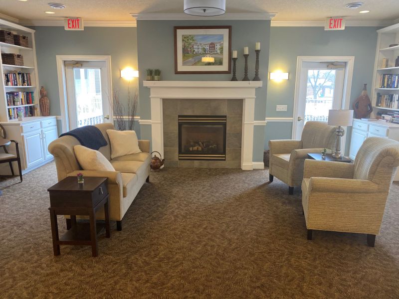 Cozy common area with seating and a fireplace