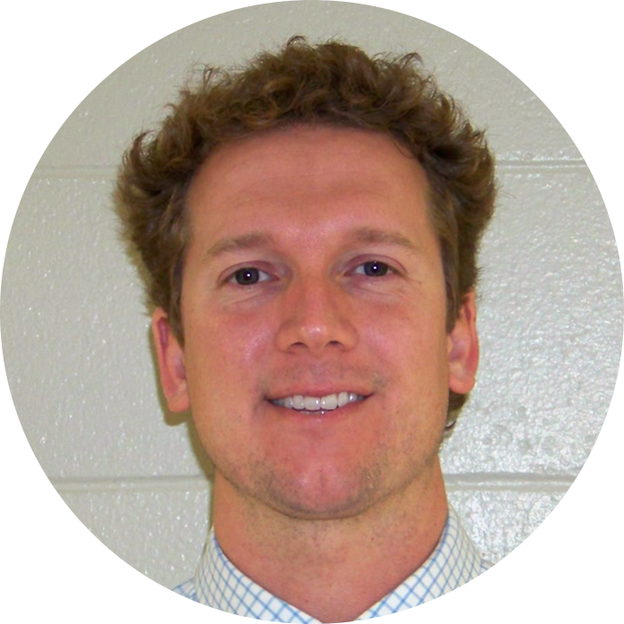 Smiling man with curly hair