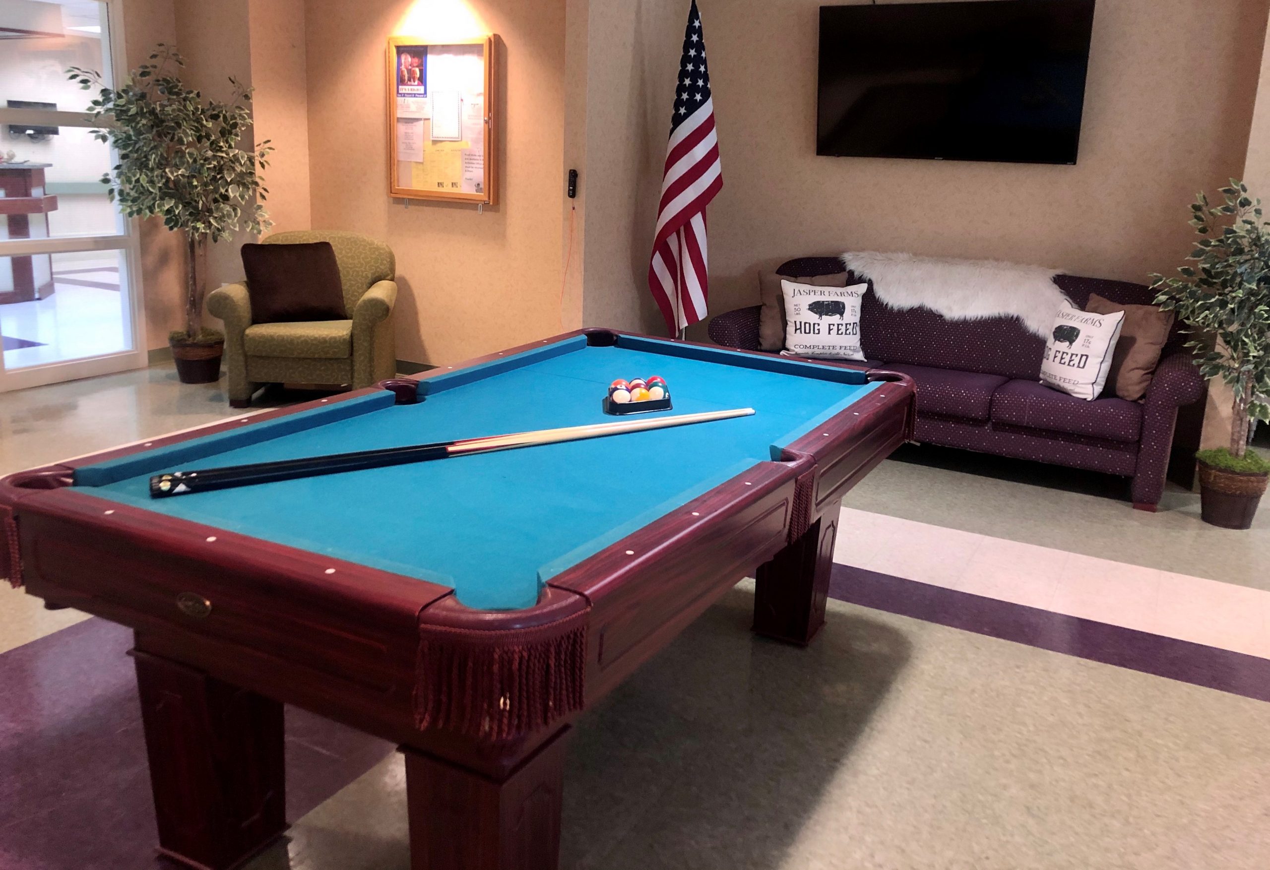 Common area with a pool table and seating