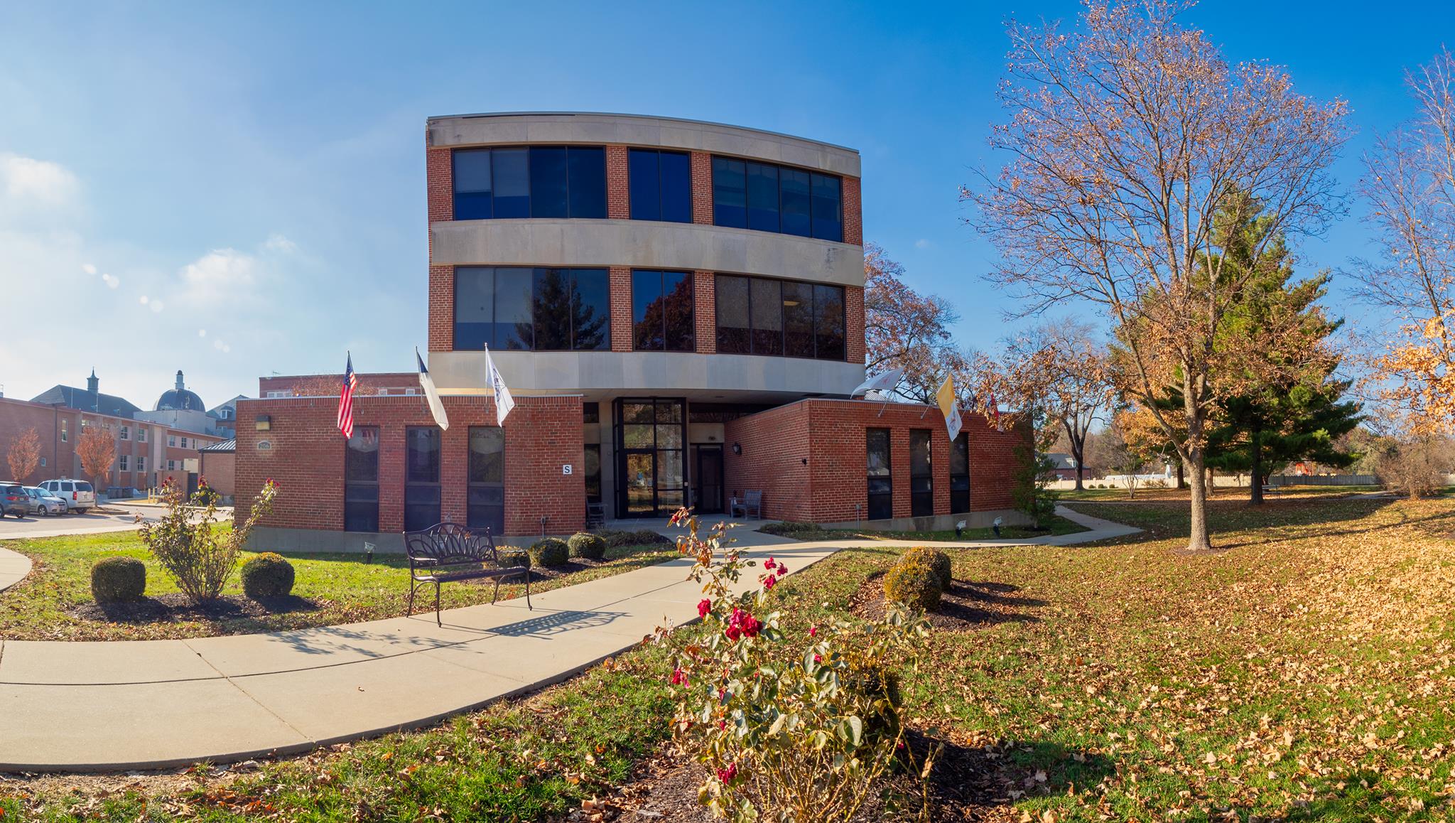 Exterior view of Abbey Senior Health building with landscaped garden
