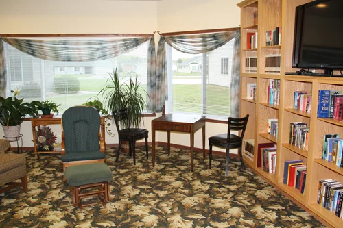 Cozy common area with books and plants