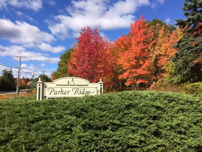 Sign for Parker Ridge surrounded by colorful fall foliage