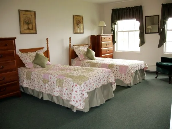 Two twin beds in a cozy resident room