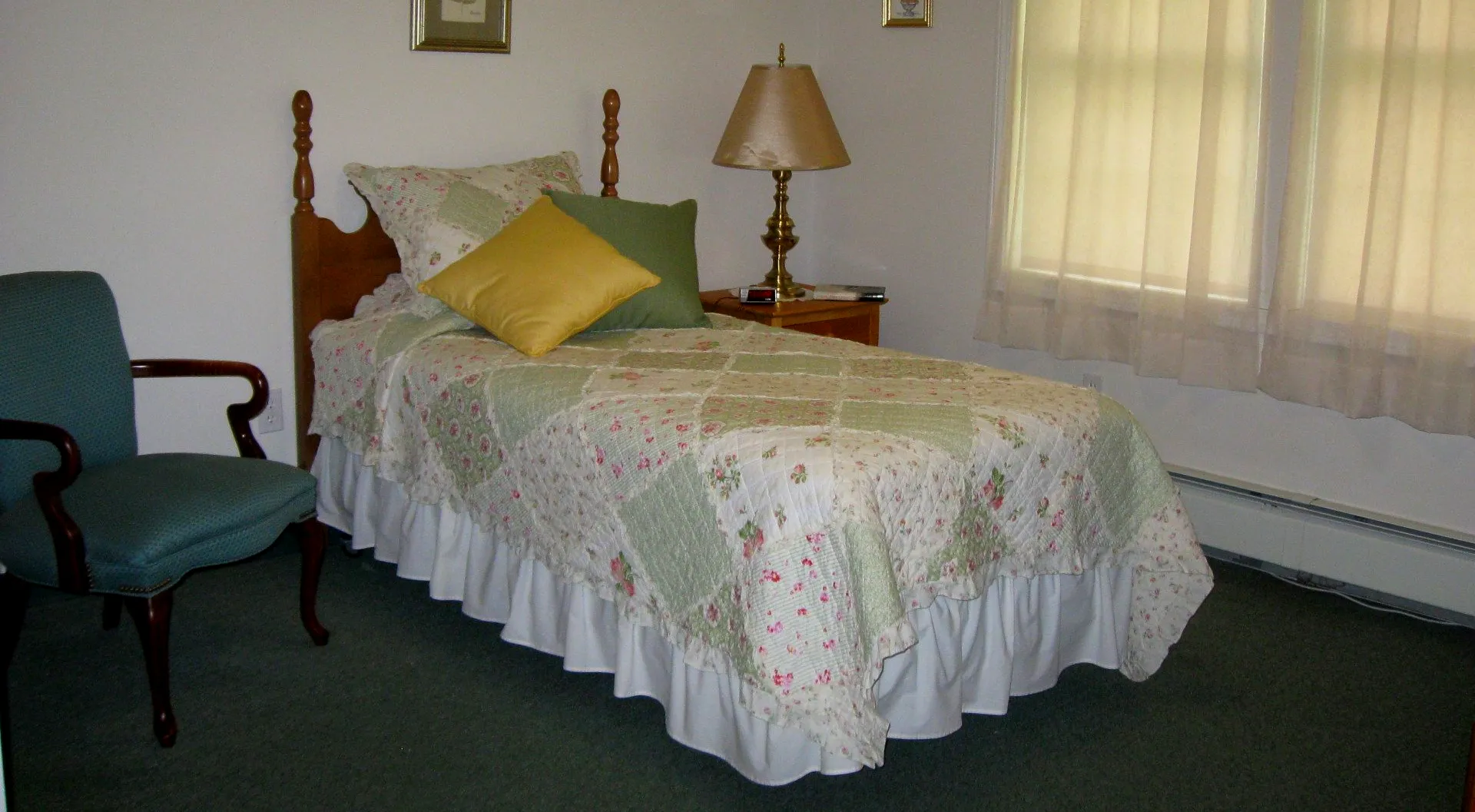 Cozy resident room with bed and lamp