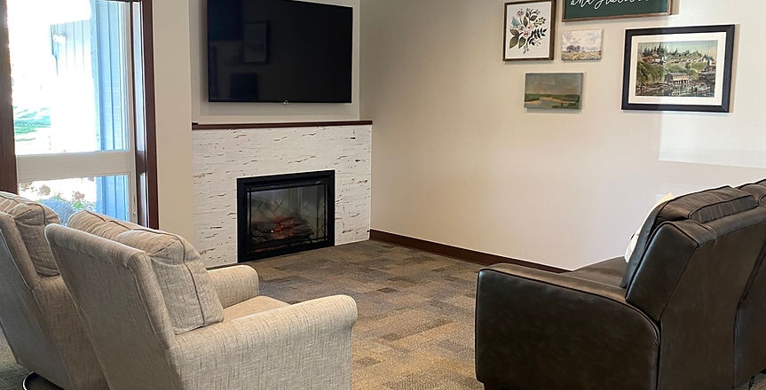 Cozy common area with seating and a fireplace