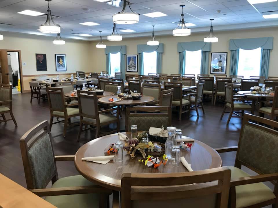 Dining room setup with tables and chairs