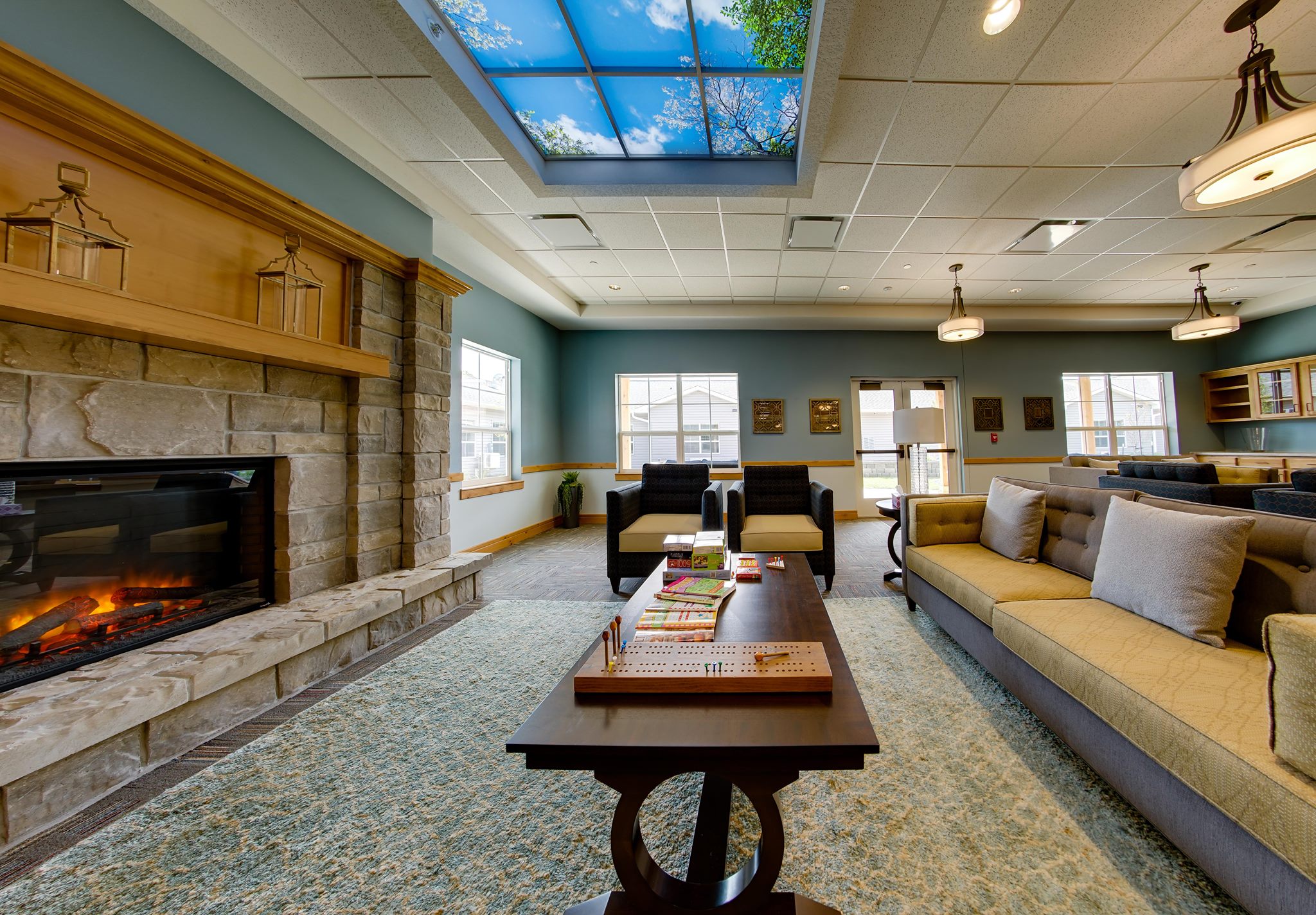 Interior common area with a cozy fireplace and seating