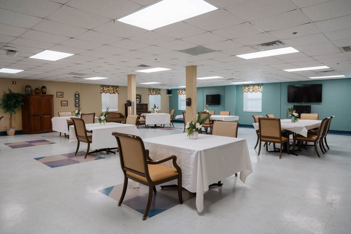 Bright dining area with tables and chairs