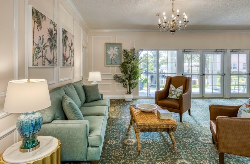 Bright common area with comfortable seating and plants