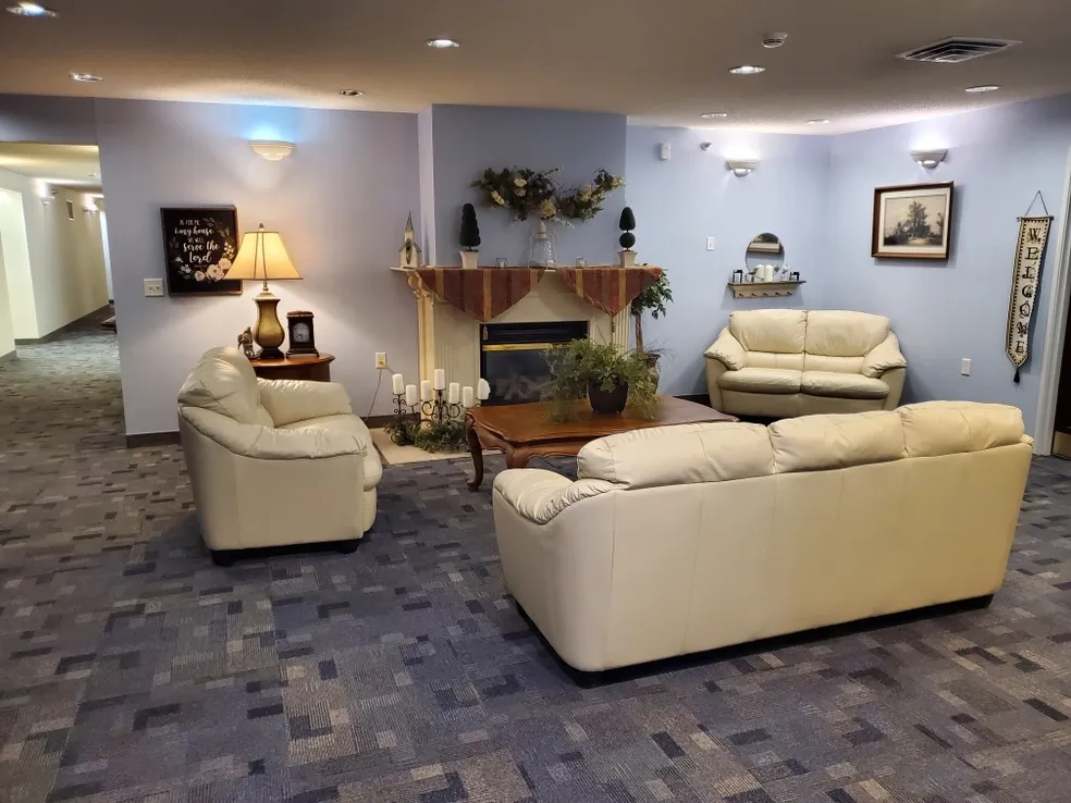 Cozy common area with sofas and a lamp