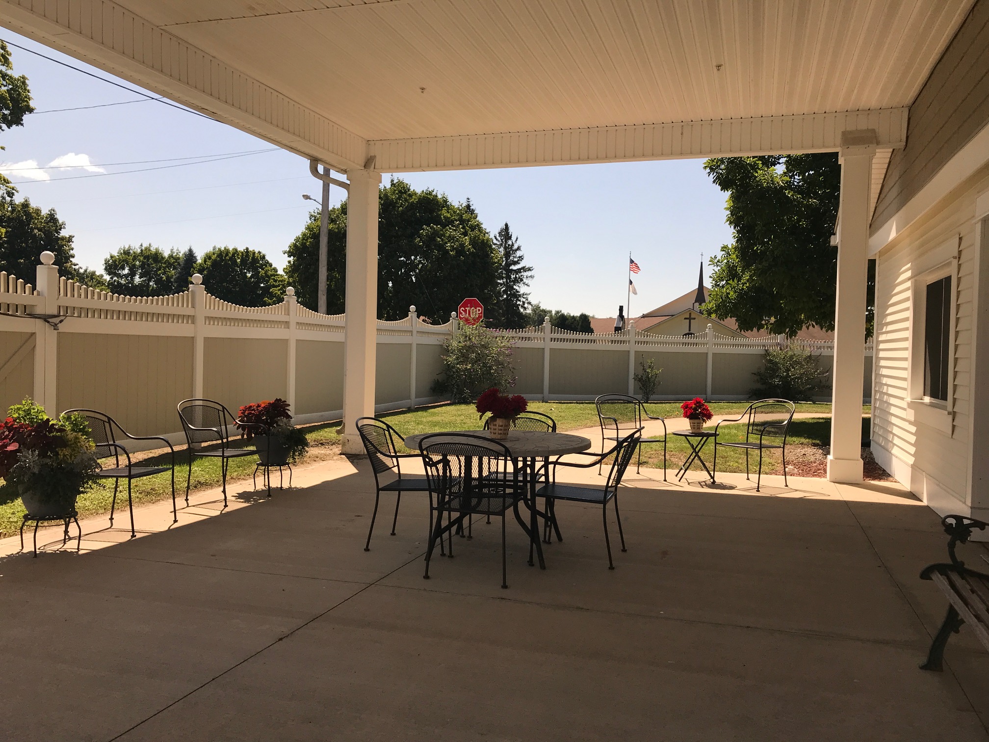 Outdoor seating area with tables and flowers