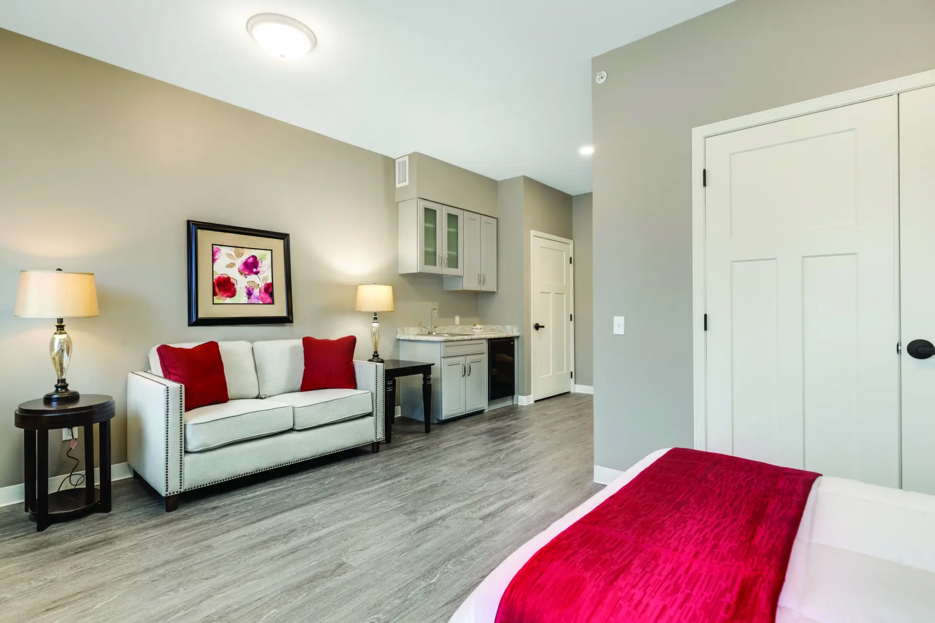 A private room with a seating area and kitchenette
