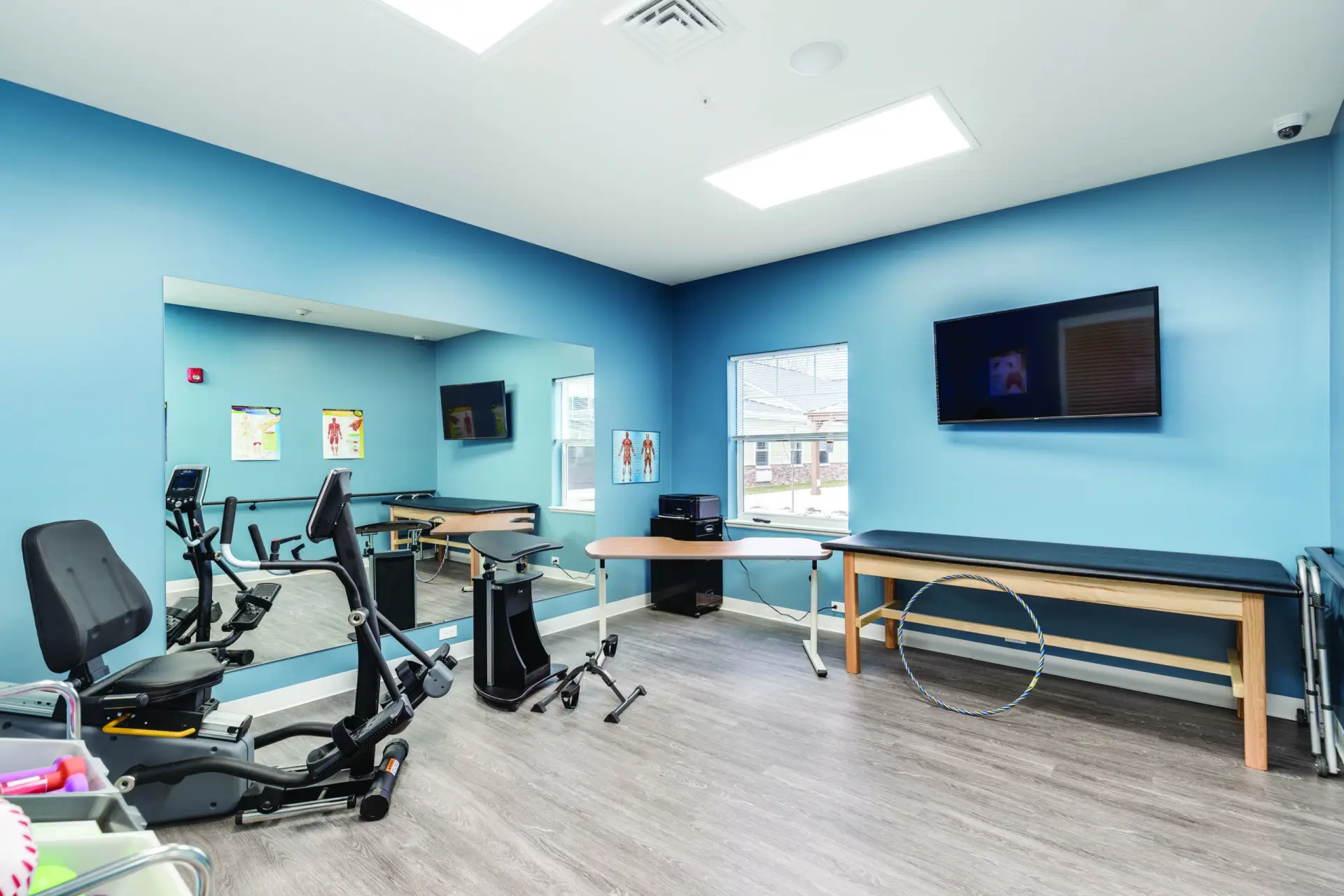 Facility fitness room with exercise equipment