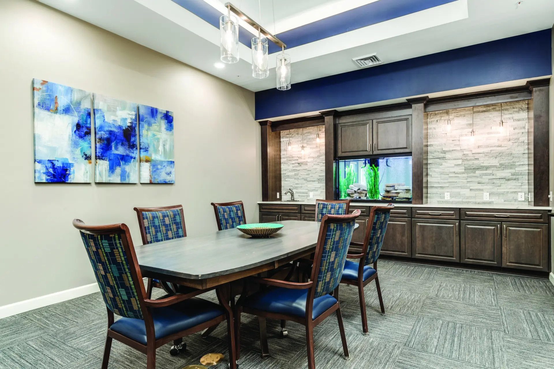 Common area with a dining table and artwork