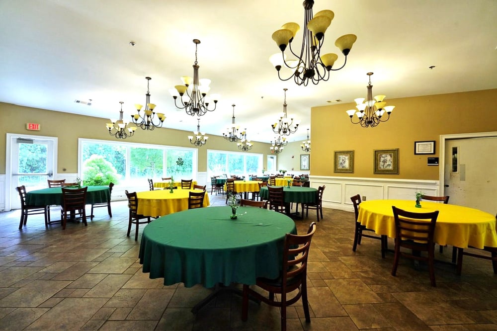 Bright dining room with tables set for meals