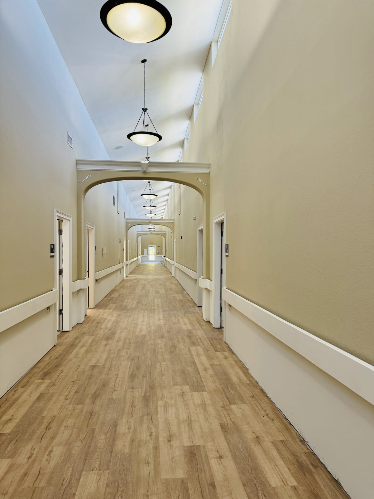A well-lit hallway in the assisted living facility