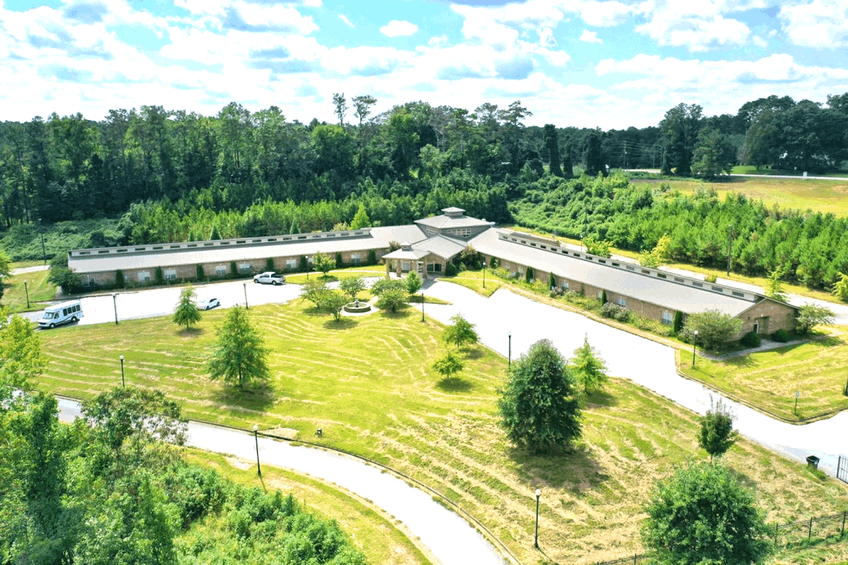 Aerial view of the assisted living facility with landscaped grounds