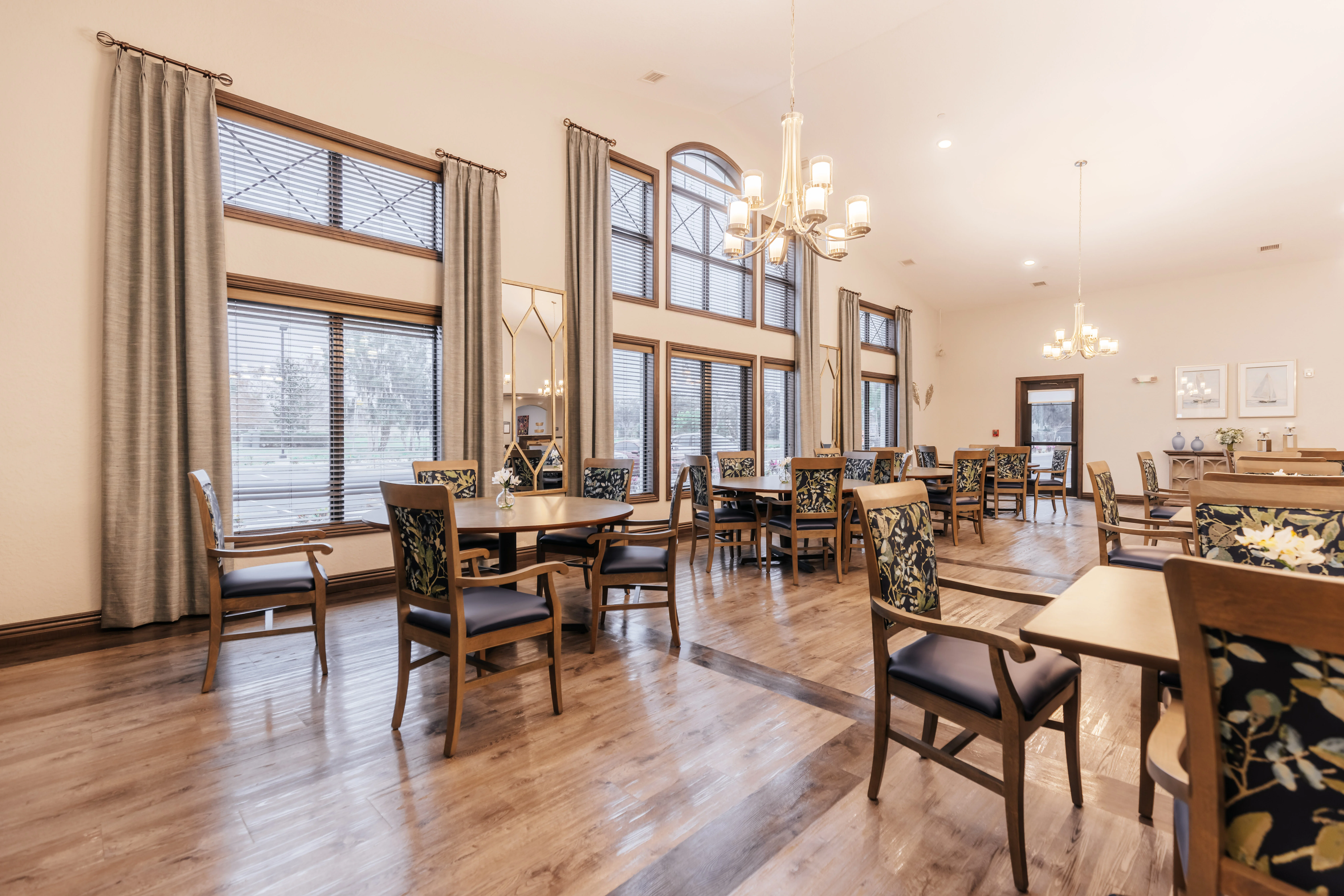 Interior dining area with wooden tables and bright lighting
