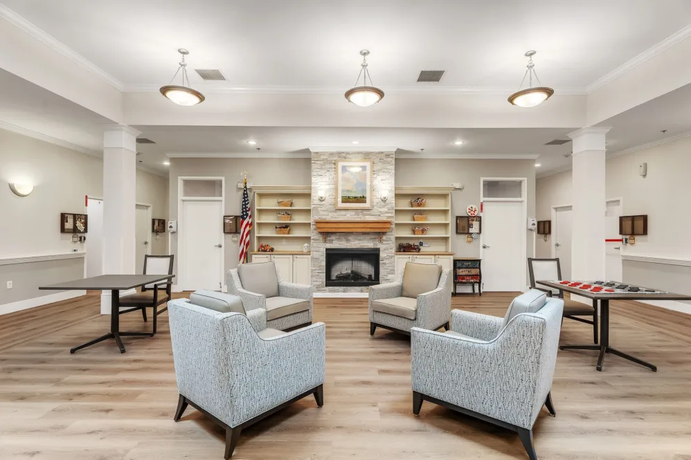 Bright common area with seating and fireplace