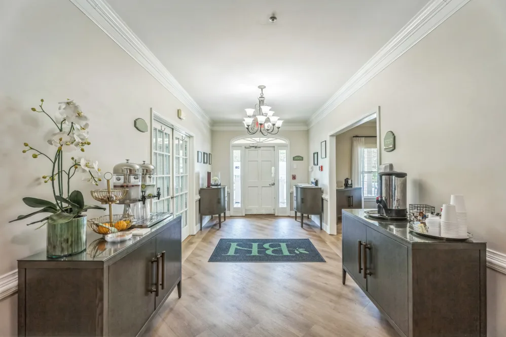 Bright interior hallway leading to a common area