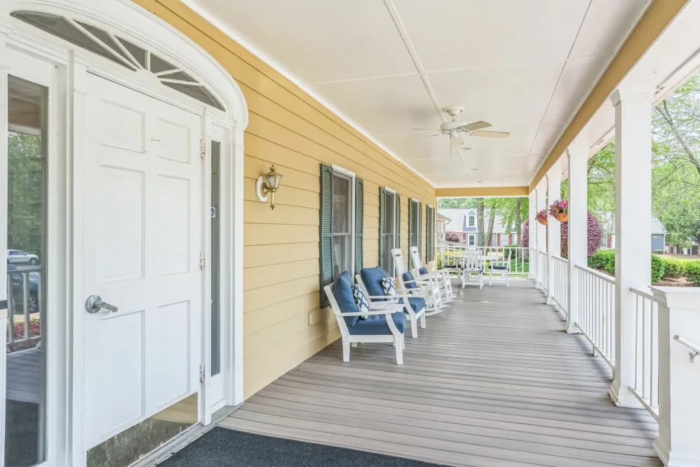 Covered porch area with seating at Barclay House
