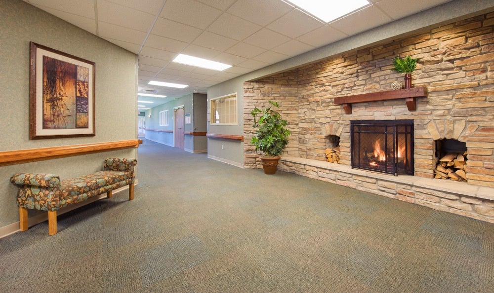 Interior view of a cozy lounge area with a fireplace