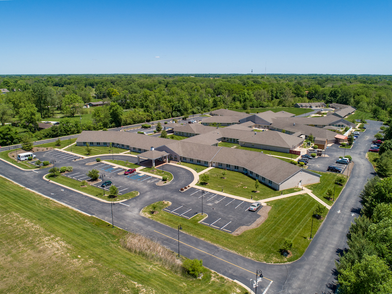 Aerial view of a large assisted living facility with multiple buildings