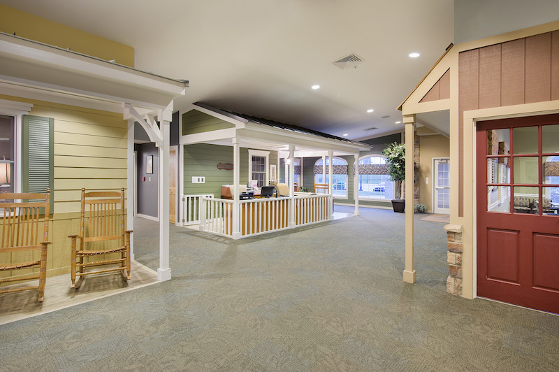 Interior view of a hallway with rocking chairs