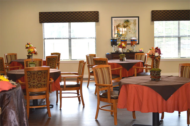 Dining area with tables and floral decorations