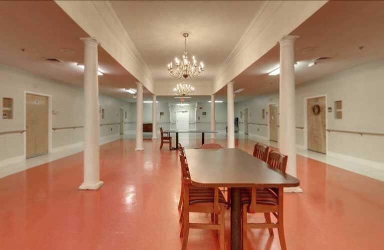 Interior view of a common area with a table and chairs