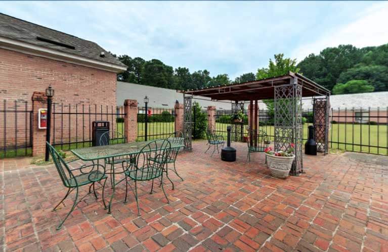 Outdoor seating area with a pergola and garden