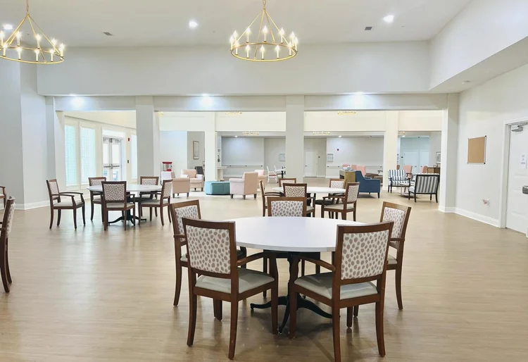 Bright interior of a common area with tables and chairs