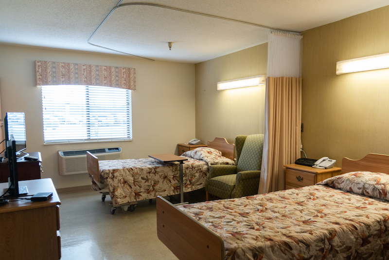 Interior view of a resident room with two beds