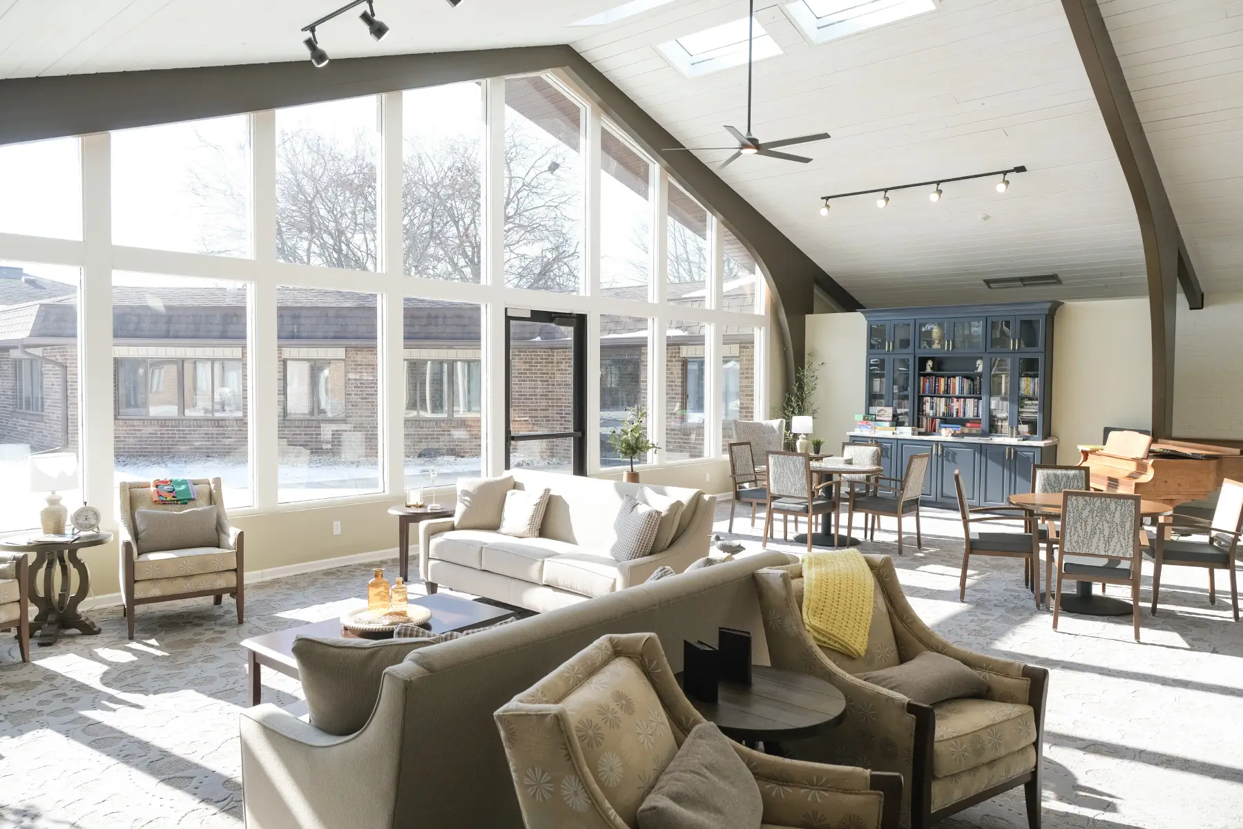 Bright common area with seating and natural light