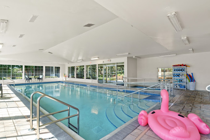 Indoor pool area with a pink float