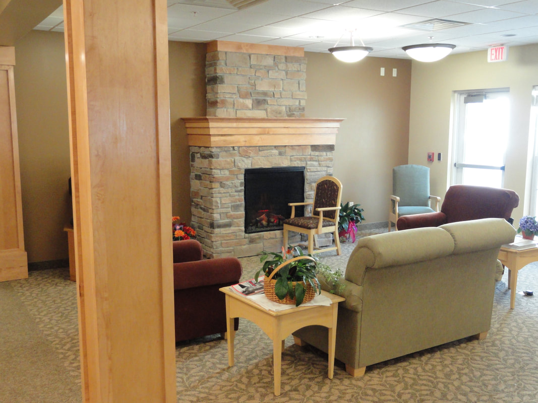 Cozy common area with seating and a fireplace