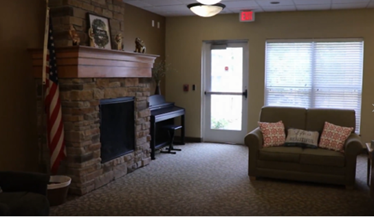 Cozy lounge area with a fireplace and seating