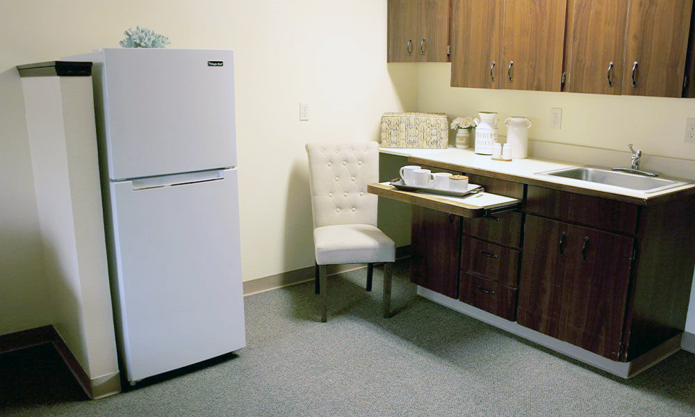 Cozy kitchenette area in a private resident room