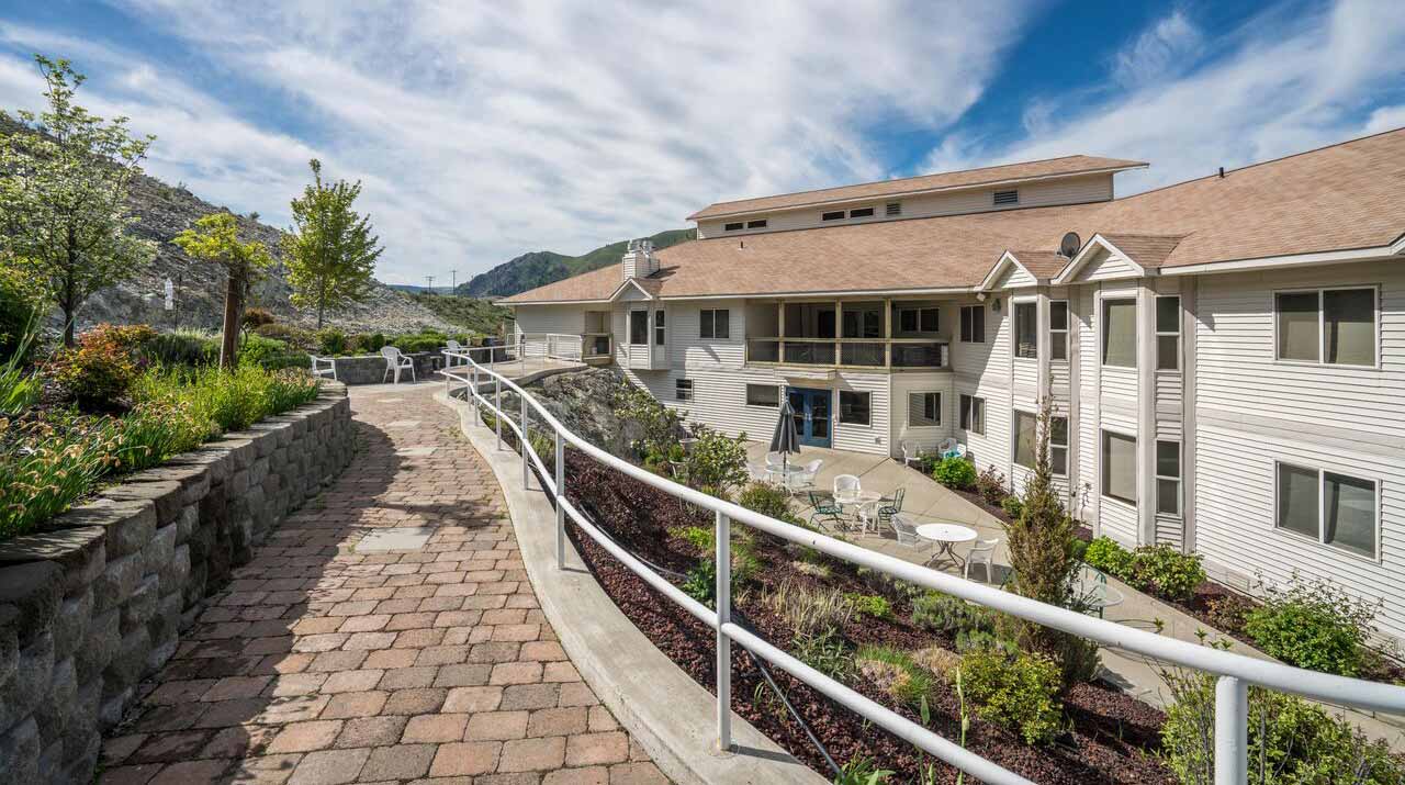 Outdoor path leading to patio area at the facility